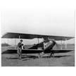 Charles Lindbergh in front of biplane vintage plane