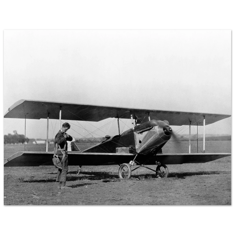 Charles Lindbergh in front of biplane vintage plane