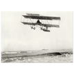 Vintage aircraft M. Van den Born flying above the sea Old photograph reproduction.