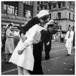 Kiss in New York city. Crowds celebrate in New York City streets after ending of World War 2 .