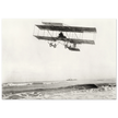 Vintage aircraft M. Van den Born flying above the sea Old photograph reproduction.