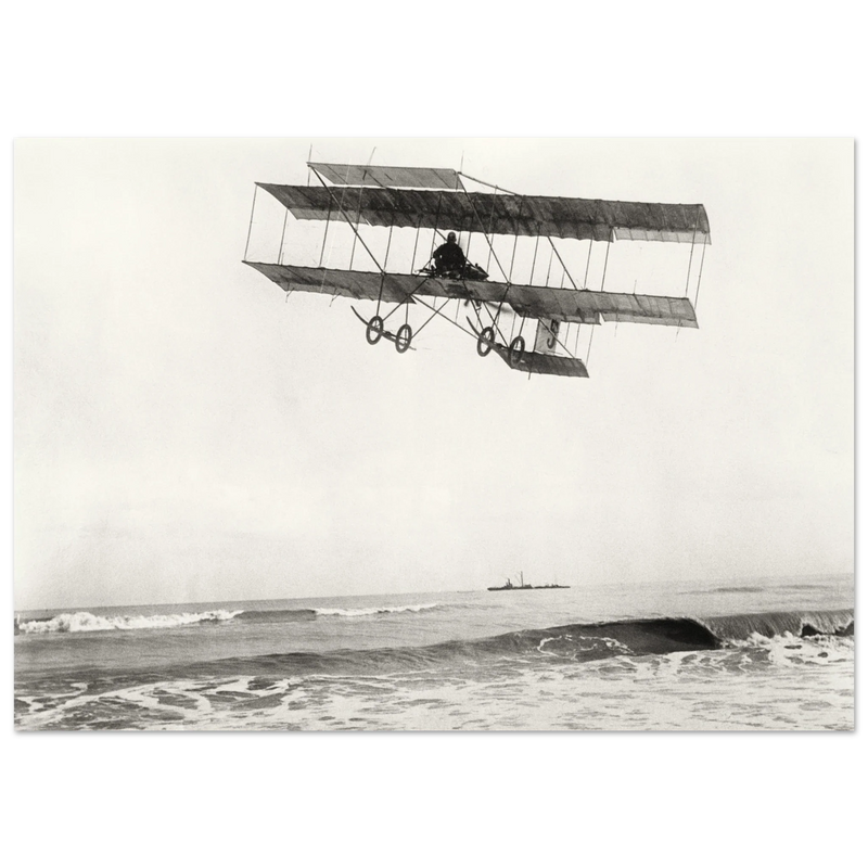 Vintage aircraft M. Van den Born flying above the sea Old photograph reproduction.