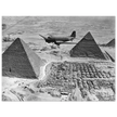 Air Transport command plane flies over the pyramids in Egypt 1943. World War 2
