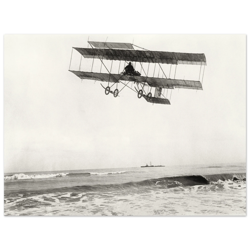 Vintage aircraft M. Van den Born flying above the sea Old photograph reproduction.