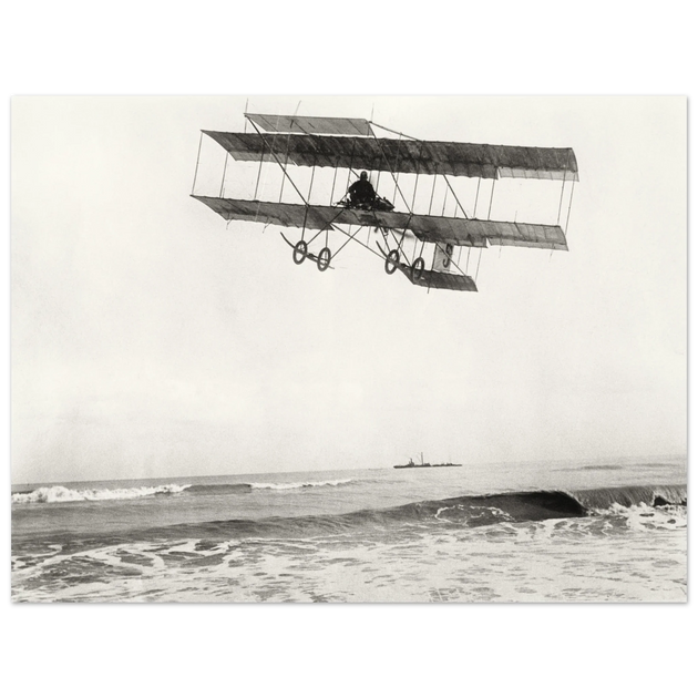 Vintage aircraft M. Van den Born flying above the sea Old photograph reproduction.