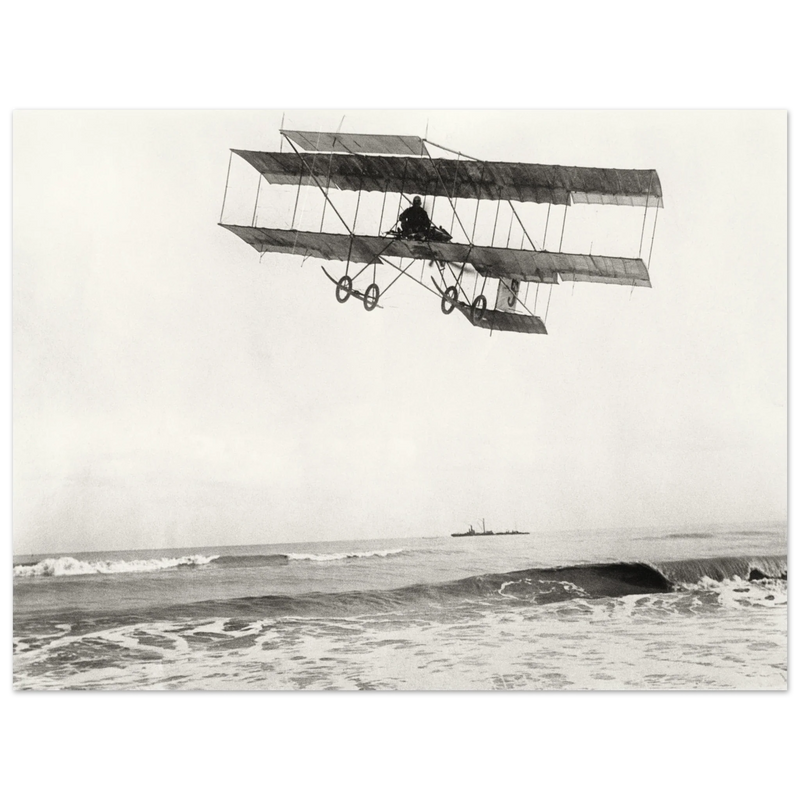 Vintage aircraft M. Van den Born flying above the sea Old photograph reproduction.