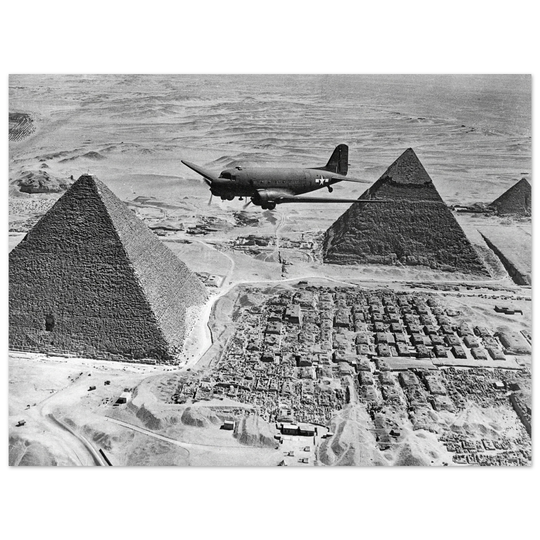 Air Transport command plane flies over the pyramids in Egypt 1943. World War 2