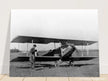 Charles Lindbergh in front of biplane vintage plane
