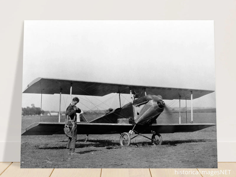 Charles Lindbergh in front of biplane vintage plane