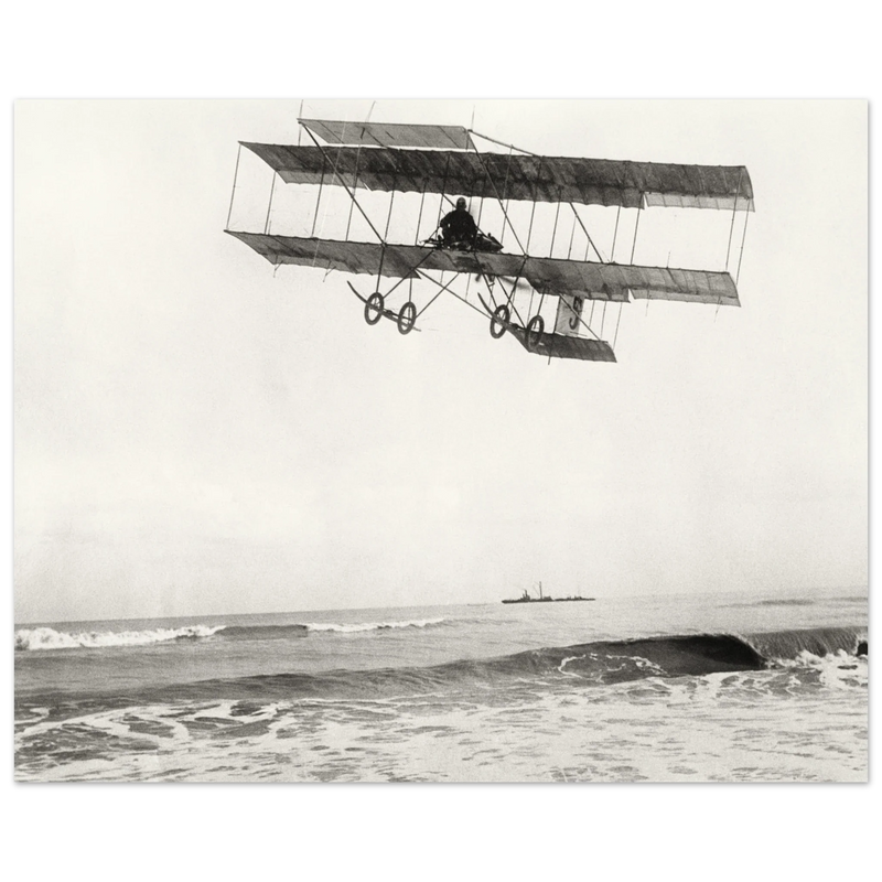 Vintage aircraft M. Van den Born flying above the sea Old photograph reproduction.