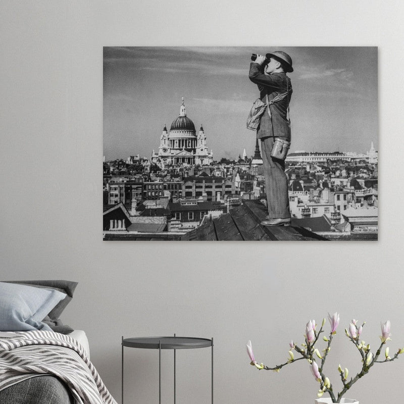 Second World War historic black and white photograph. Aircraft spotter on a roof in London.