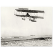 Vintage aircraft M. Van den Born flying above the sea Old photograph reproduction.