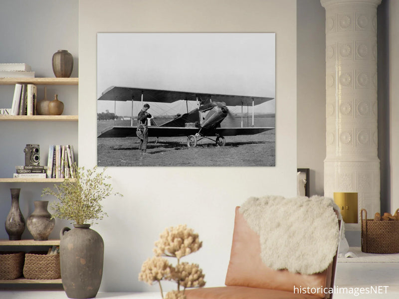 Charles Lindbergh in front of biplane vintage plane