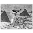 Air Transport command plane flies over the pyramids in Egypt 1943. World War 2