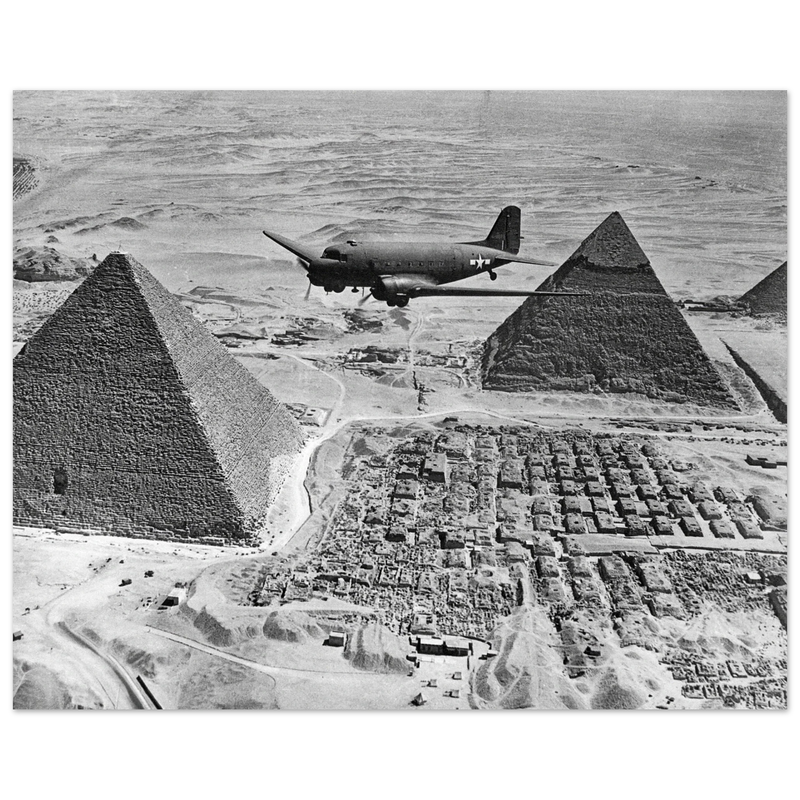 Air Transport command plane flies over the pyramids in Egypt 1943. World War 2