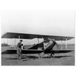 Charles Lindbergh in front of biplane vintage plane