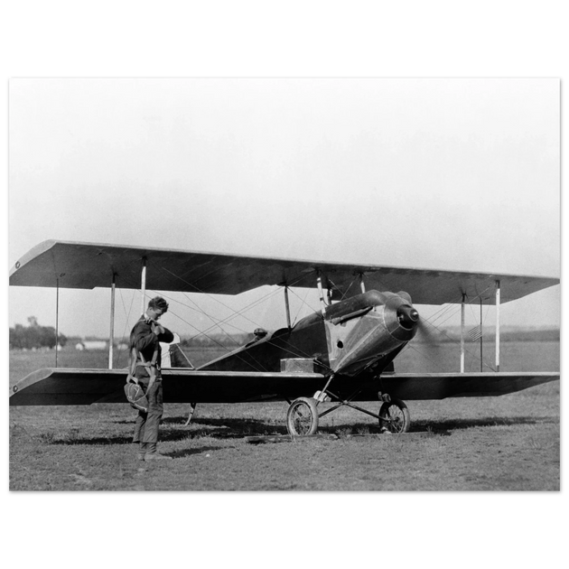 Charles Lindbergh in front of biplane vintage plane