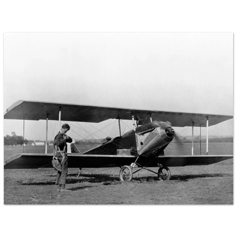 Charles Lindbergh in front of biplane vintage plane