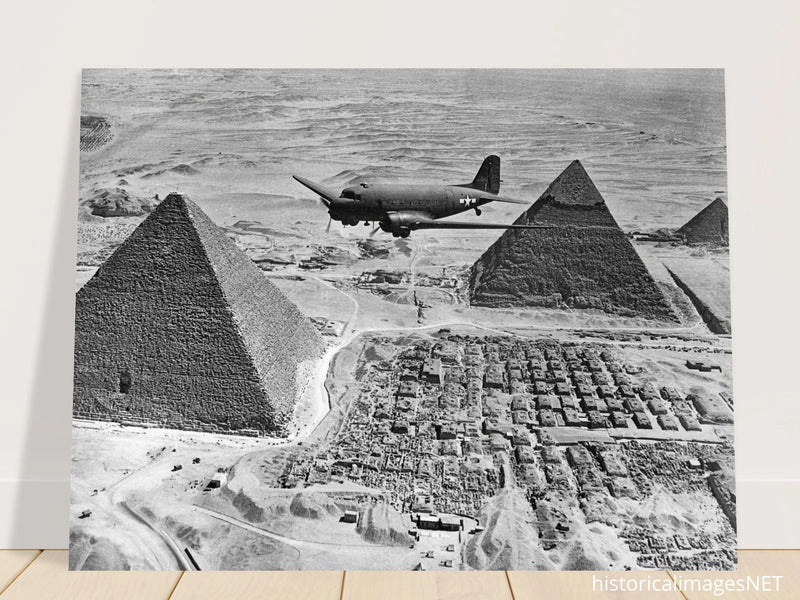 Air Transport command plane flies over the pyramids in Egypt 1943. World War 2