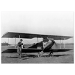Charles Lindbergh in front of biplane vintage plane