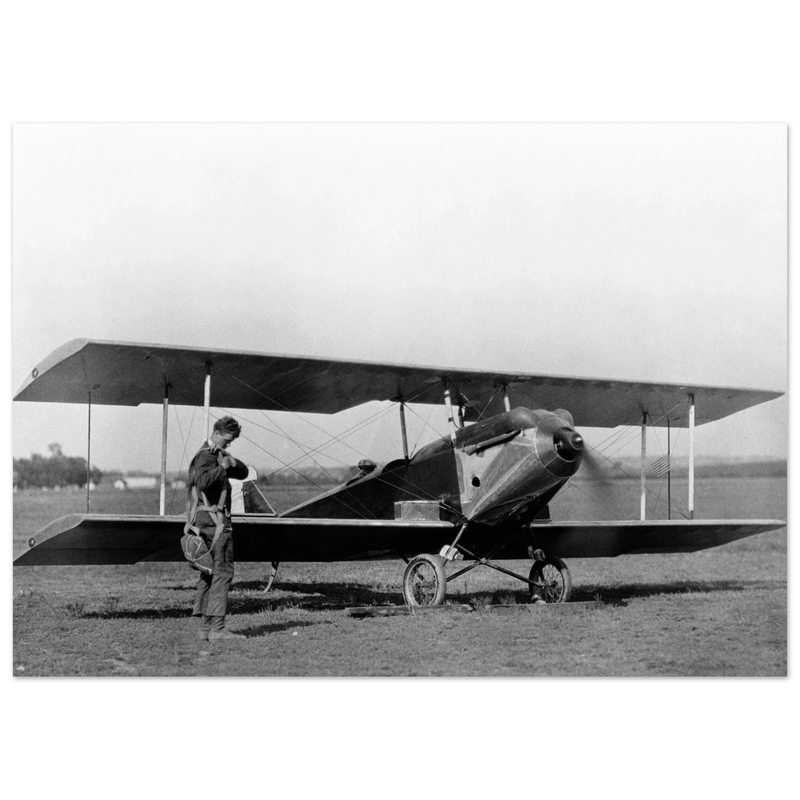 Charles Lindbergh in front of biplane vintage plane