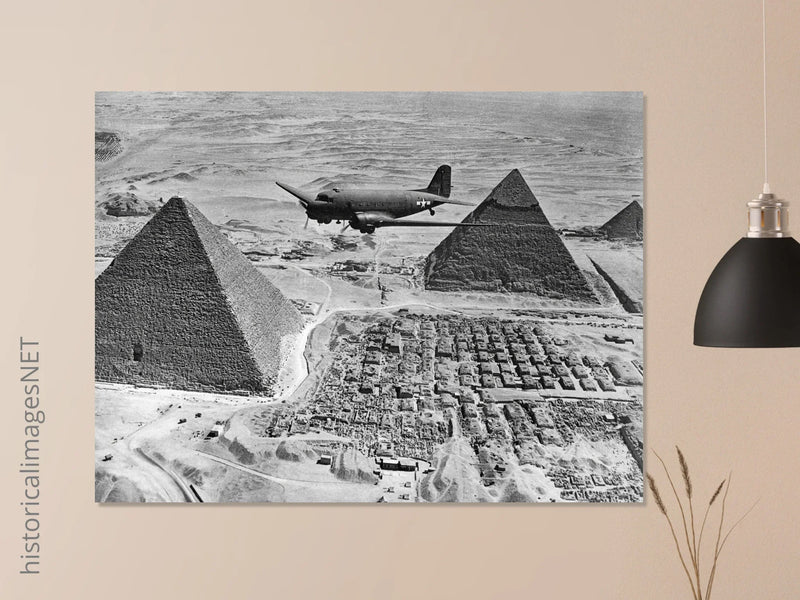 Air Transport command plane flies over the pyramids in Egypt 1943. World War 2