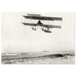 Vintage aircraft M. Van den Born flying above the sea Old photograph reproduction.