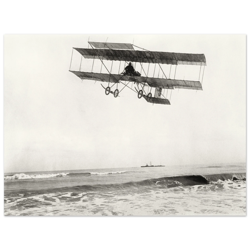 Vintage aircraft M. Van den Born flying above the sea Old photograph reproduction.