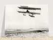 Vintage aircraft M. Van den Born flying above the sea Old photograph reproduction.