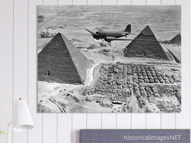 Air Transport command plane flies over the pyramids in Egypt 1943. World War 2