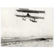 Vintage aircraft M. Van den Born flying above the sea Old photograph reproduction.