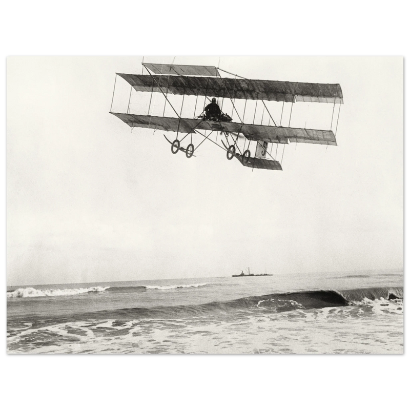 Vintage aircraft M. Van den Born flying above the sea Old photograph reproduction.