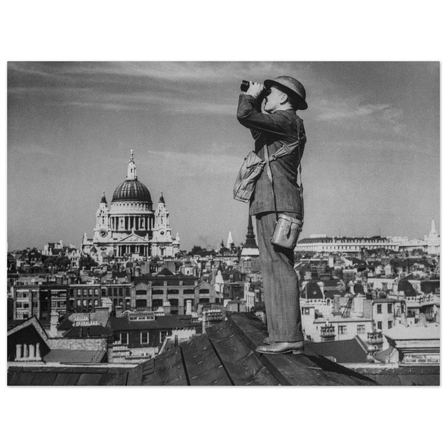 Second World War historic black and white photograph. Aircraft spotter on a roof in London.