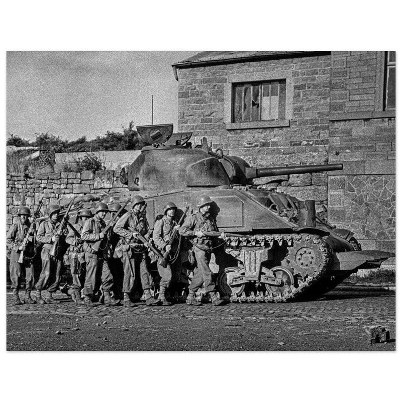 World war 2 black and white photograph. tank and american soldiers advancing in Belgium