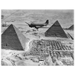 Air Transport command plane flies over the pyramids in Egypt 1943. World War 2