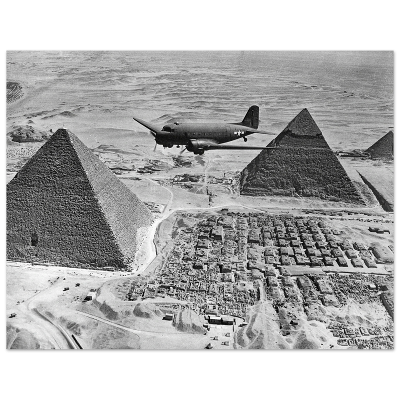 Air Transport command plane flies over the pyramids in Egypt 1943. World War 2