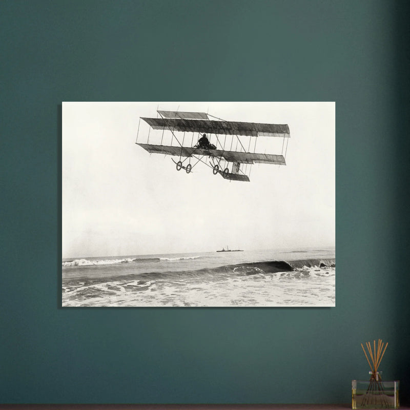 Vintage aircraft M. Van den Born flying above the sea Old photograph reproduction.