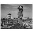 Second World War historic black and white photograph. Aircraft spotter on a roof in London.