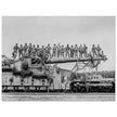 World War 2 black and white photograph. Railroad gun with soldiers on top.