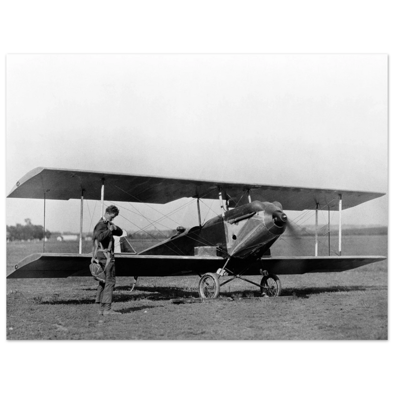 Charles Lindbergh in front of biplane vintage plane