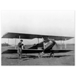 Charles Lindbergh in front of biplane vintage plane