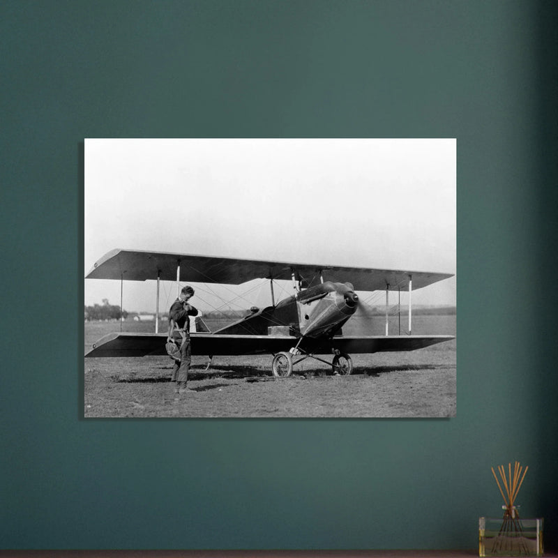 Charles Lindbergh in front of biplane vintage plane