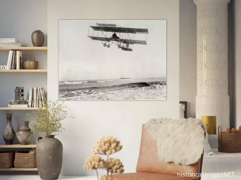 Vintage aircraft M. Van den Born flying above the sea Old photograph reproduction.
