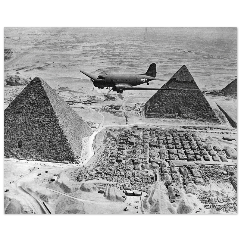 Air Transport command plane flies over the pyramids in Egypt 1943. World War 2