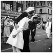 Kiss in New York city. Crowds celebrate in New York City streets after ending of World War 2 .