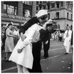 Kiss in New York city. Crowds celebrate in New York City streets after ending of World War 2 .