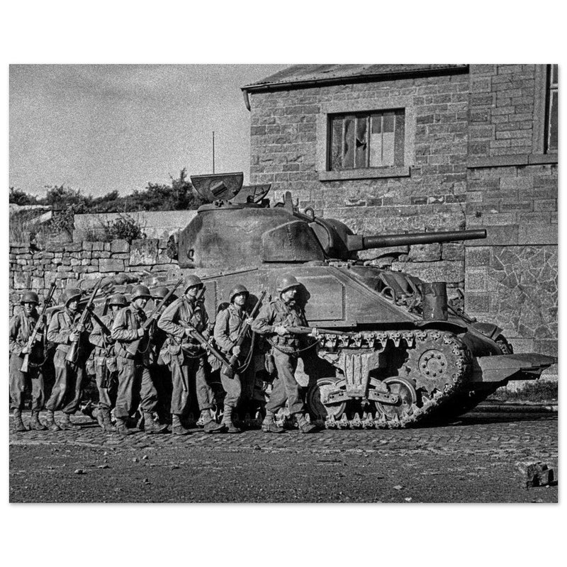 World war 2 black and white photograph. tank and american soldiers advancing in Belgium