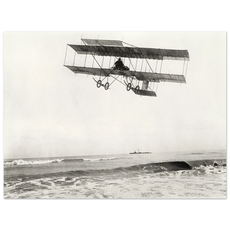 Vintage aircraft M. Van den Born flying above the sea Old photograph reproduction.