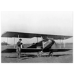 Charles Lindbergh in front of biplane vintage plane
