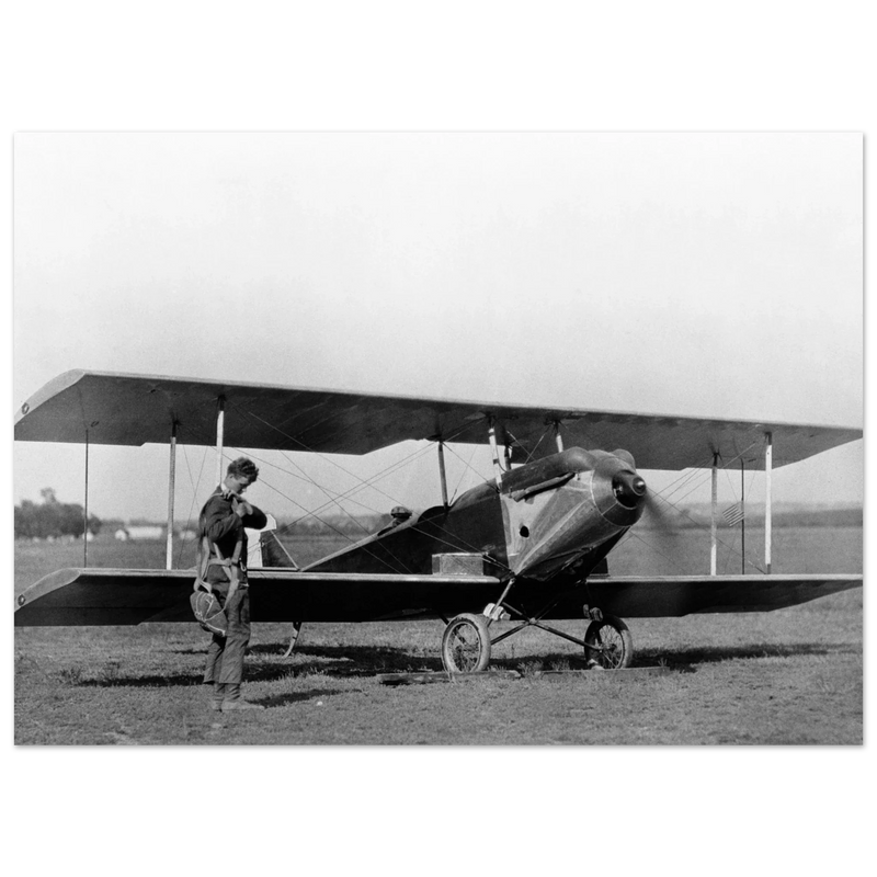 Charles Lindbergh in front of biplane vintage plane